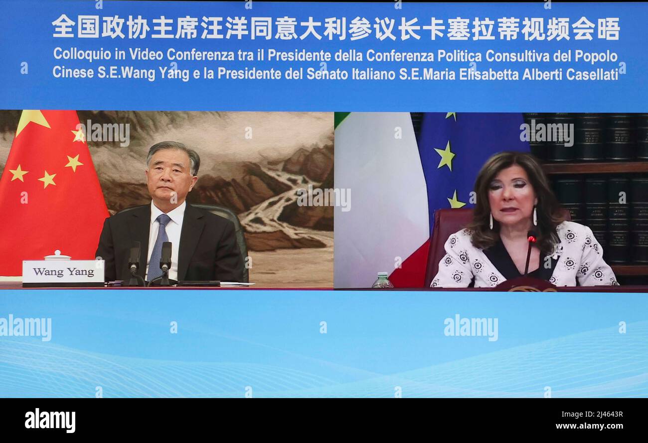 Beijing, China. 12th Apr, 2022. Wang Yang, chairman of the Chinese People's Political Consultative Conference National Committee, meets with Italian Senate Speaker Maria Elisabetta Alberti Casellati via video link in Beijing, capital of China, April 12, 2022. Credit: Liu Weibing/Xinhua/Alamy Live News Stock Photo