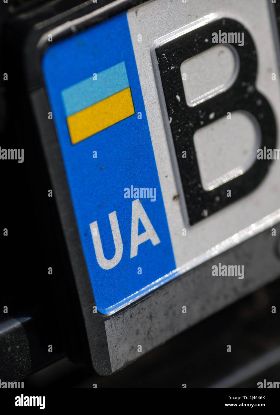 Shallow depth of field (selective focus) details with an Ukrainian plate number. Stock Photo