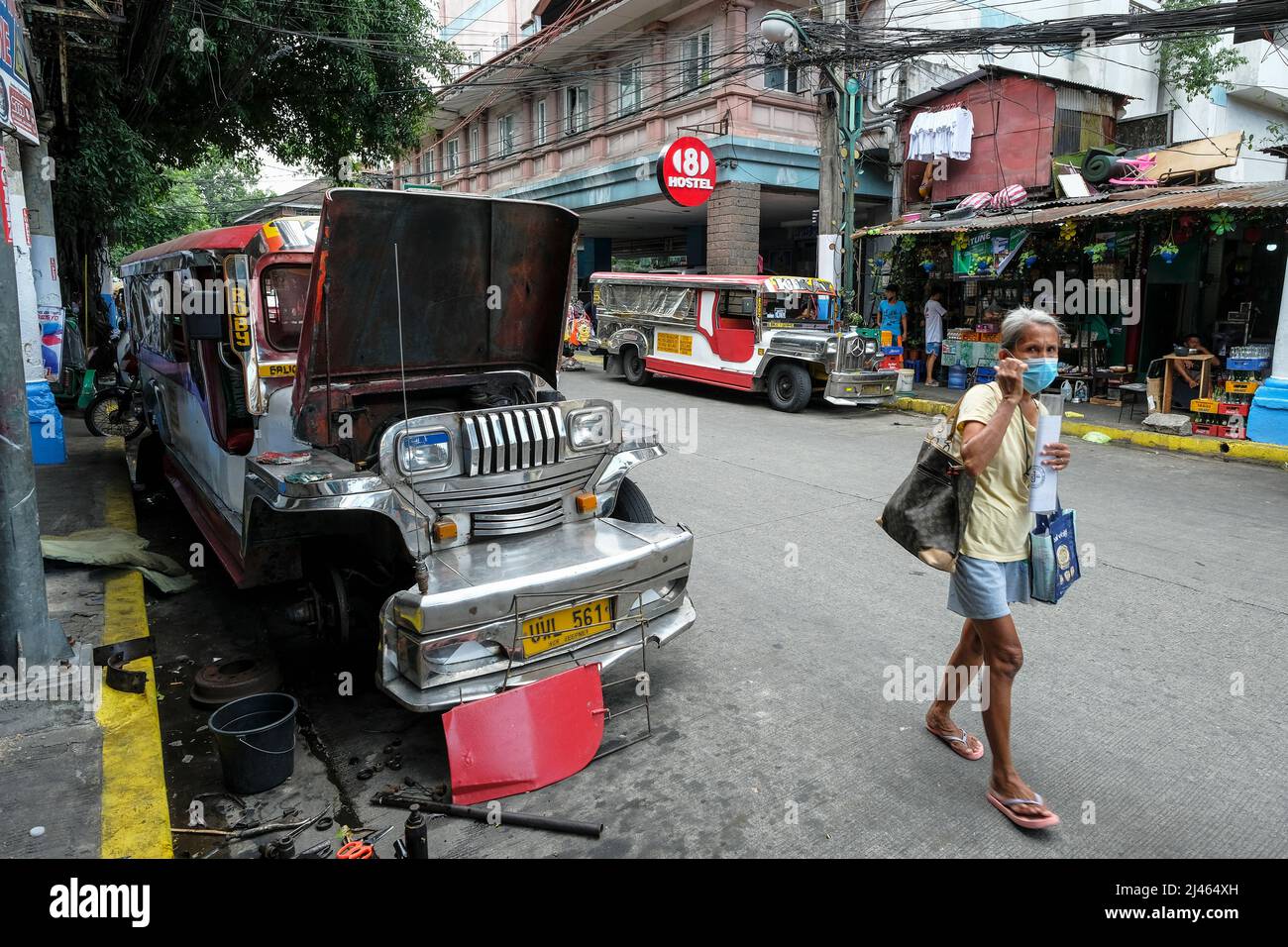 Manila, Philippines - March 2022: Jeepneys parked on a street in Manila on March 28, 2022. The jeepney is the urban transport in Manila, Philippines. Stock Photo