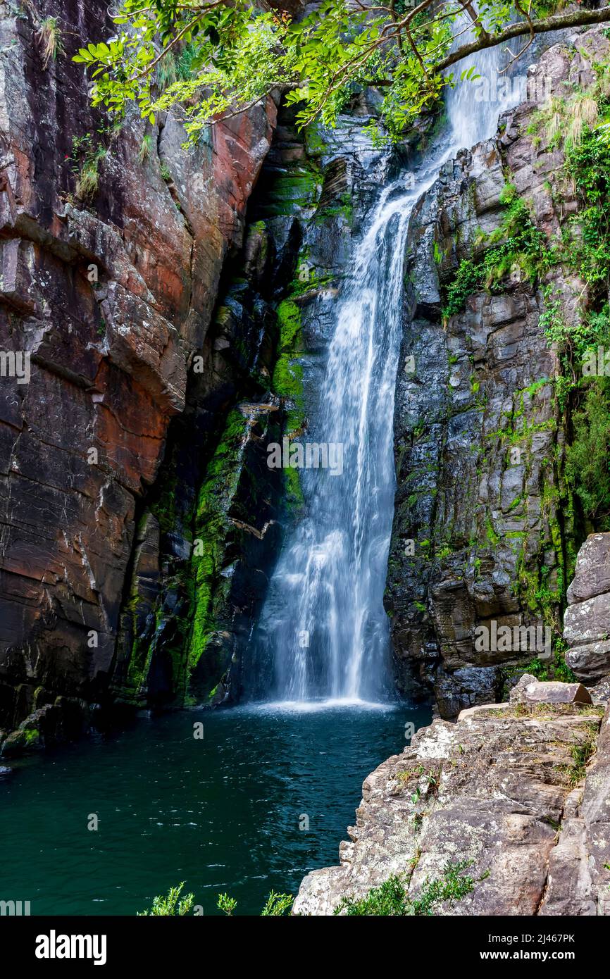 Beautiful cascade of Veu da Noiva between the covered stones of moss and the vegetation located in an area of completely preserved nature in the sta Stock Photo