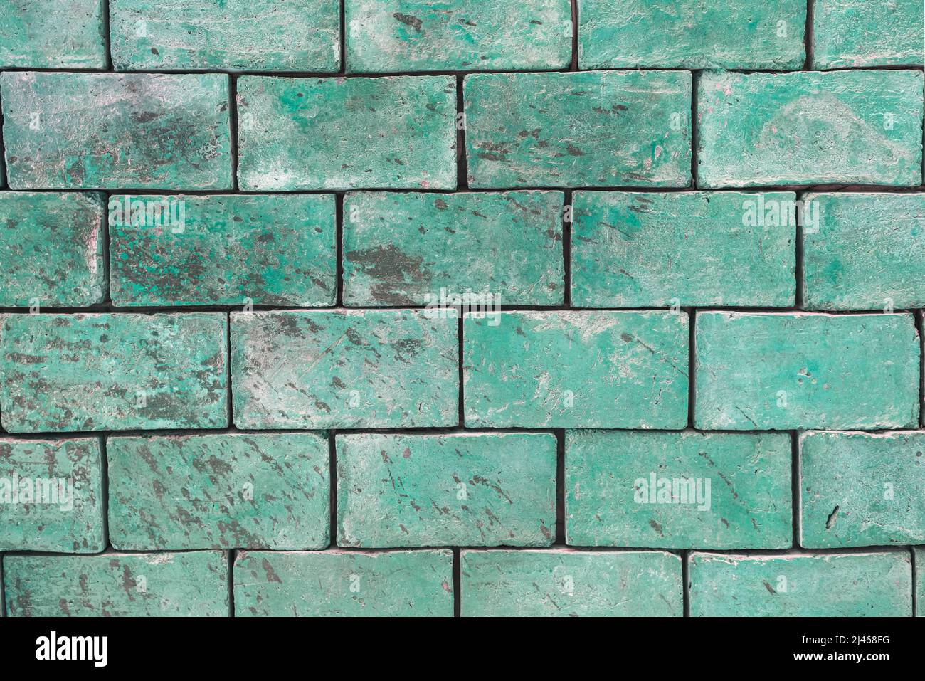 Background texture of a brick wall of poisonous green, greenish shades