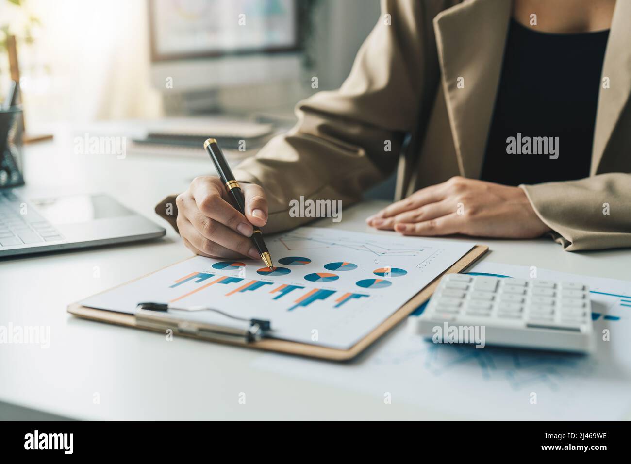 business woman working data document graph chart report marketing research development planning management strategy analysis financial accounting Stock Photo