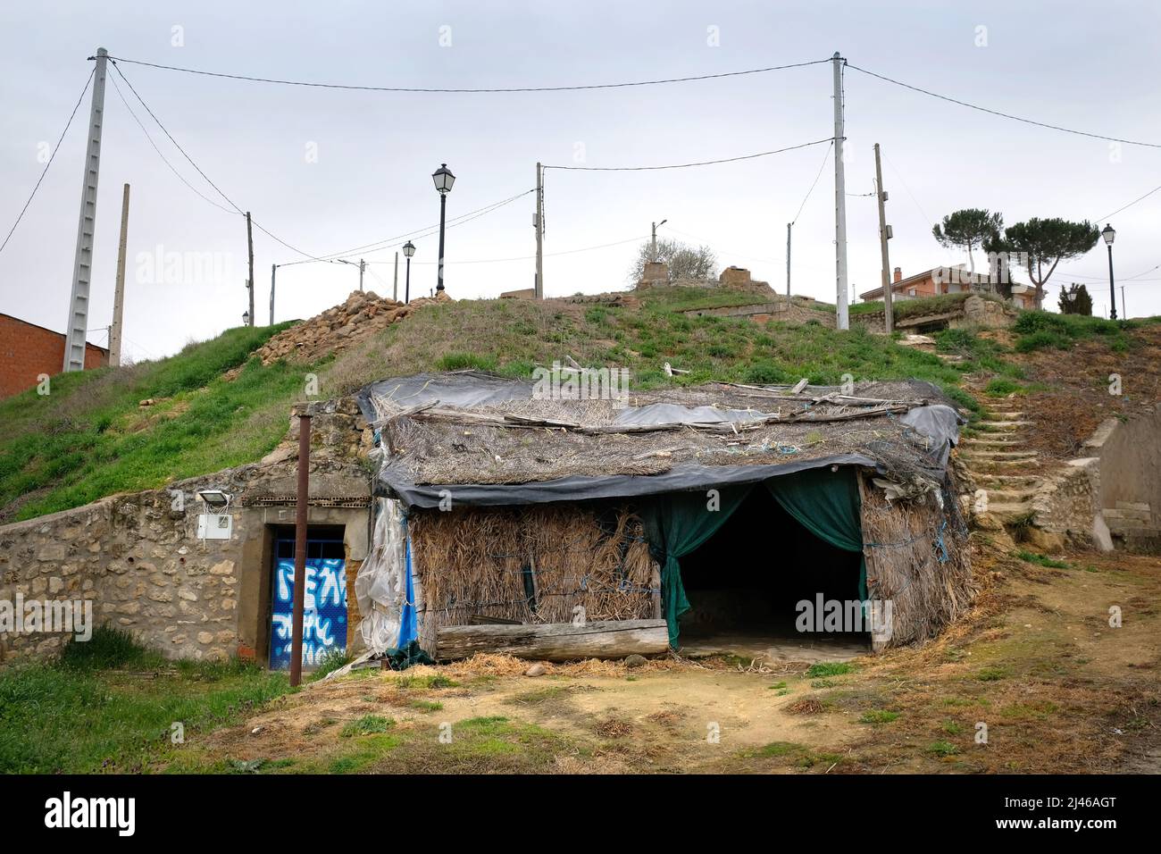 Makeshift, gymcrack entrance to one of the underground bodegas used for wine storage in Venialbo, Zamora, Castile and León, Spain Stock Photo