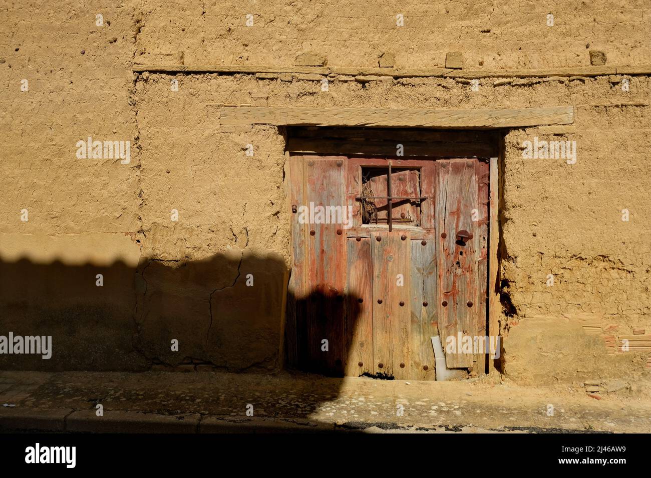 The door of a derelict mudbrick, or adobe, house in Becerril de Campos, Palencia, Castile and León, Spain Stock Photo