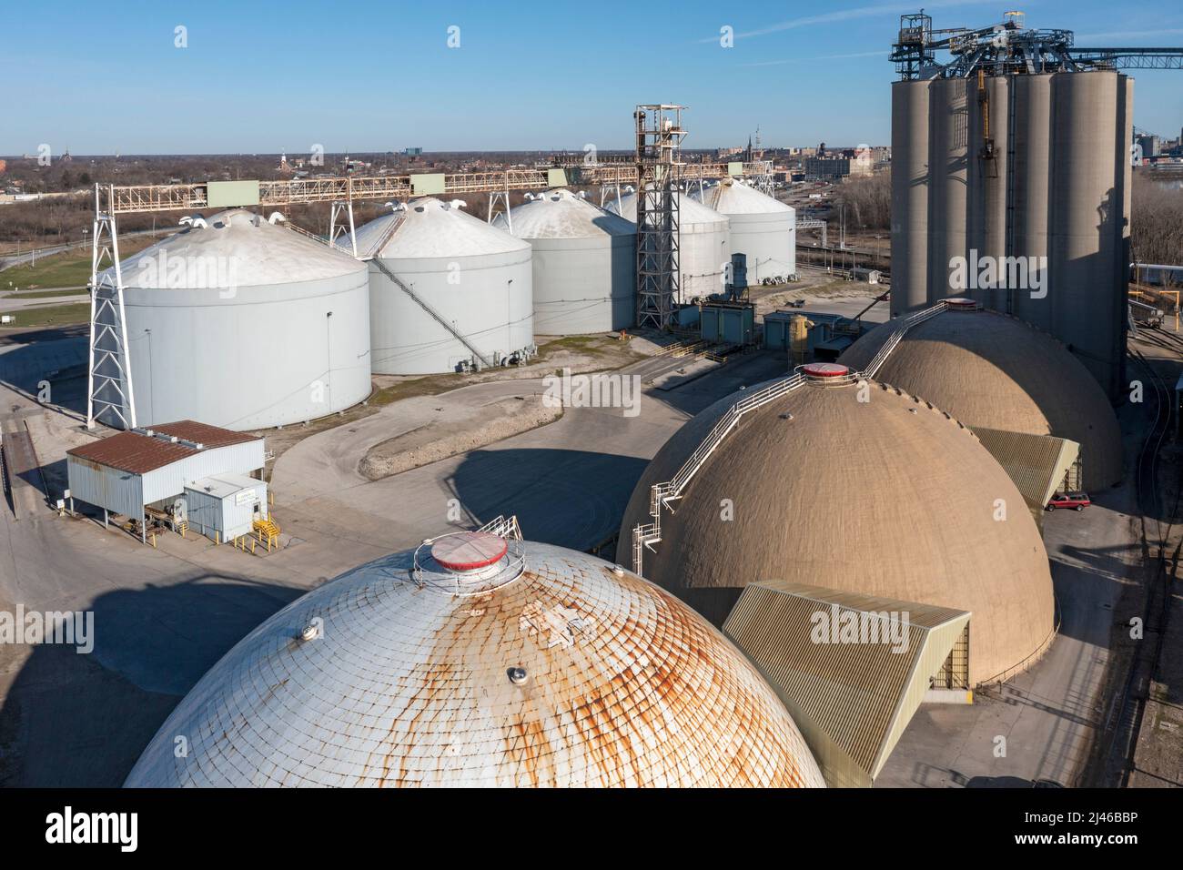 Toledo, Ohio - Fertilizer storage domes and a grain terminal on the Maumee River operated by The Andersons, a major agribusiness corporation. Stock Photo
