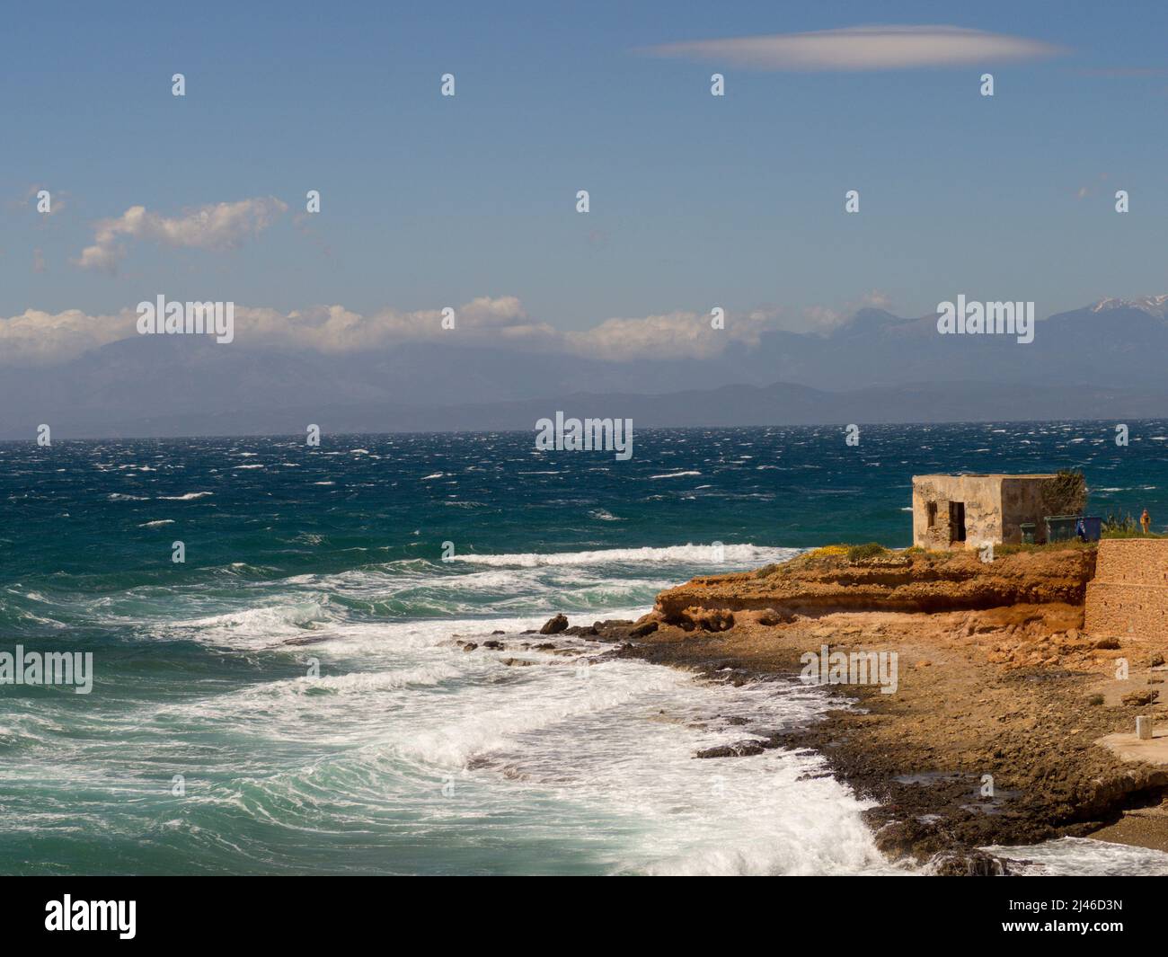 Abandoned house by the sea during a windy day Stock Photo