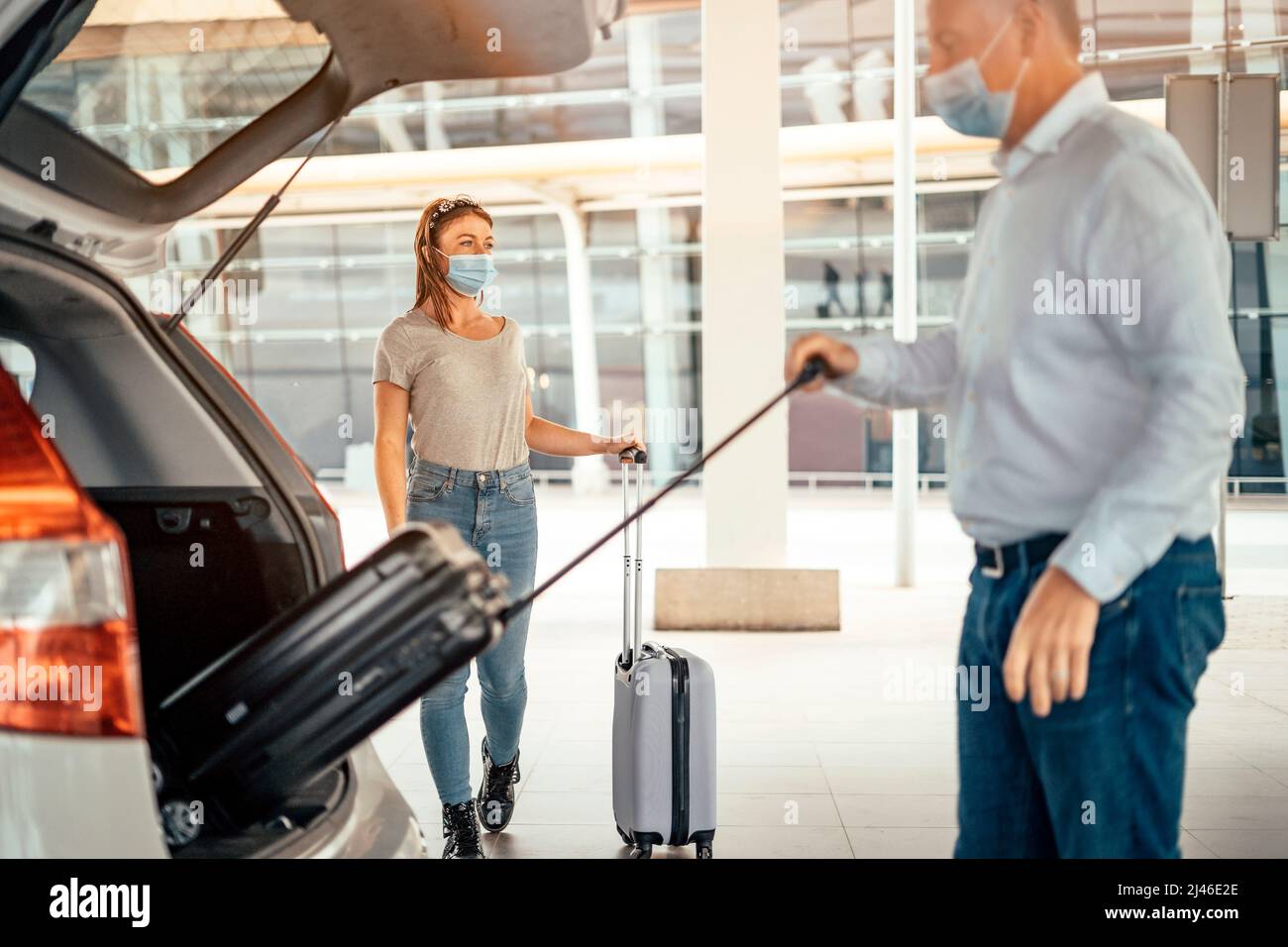 Woman airport luggage taxi hi-res stock photography and images - Alamy