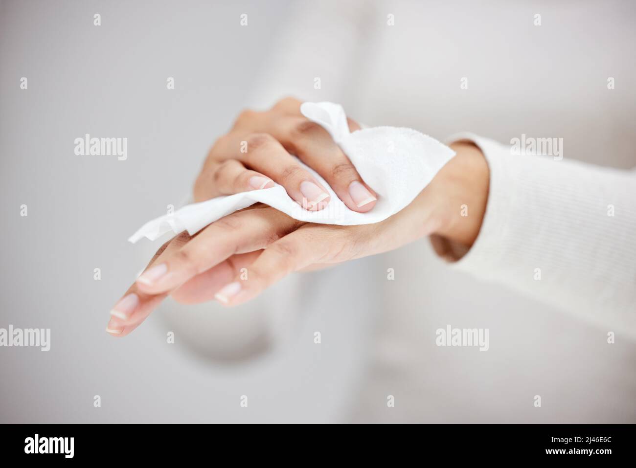 Wiping the germs away. Shot of an unrecognizable person using a wipe to