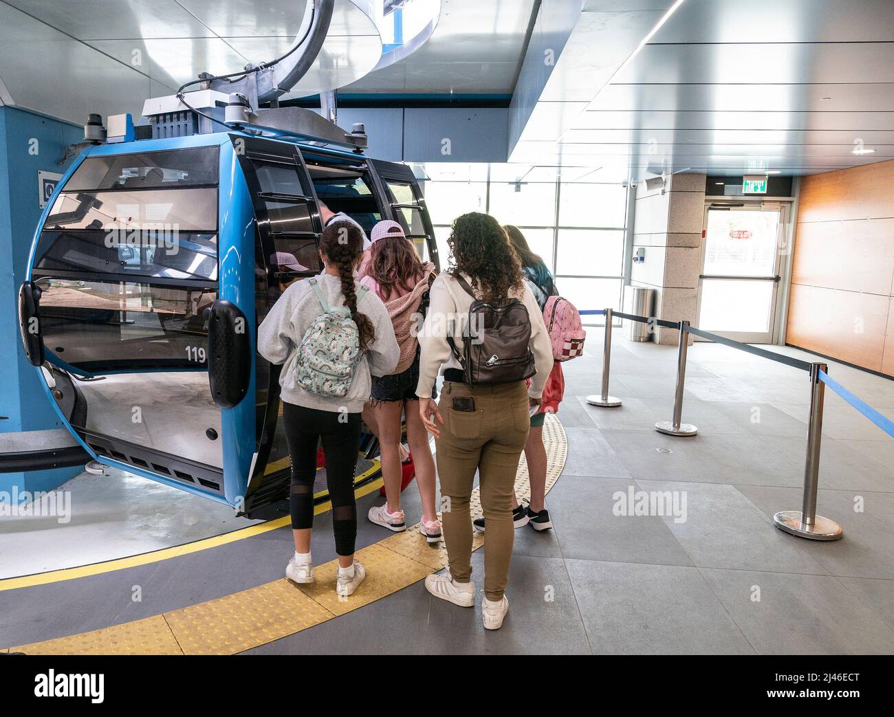People board Rakavlit - commuter service cable car (funicular) in Haifa ...