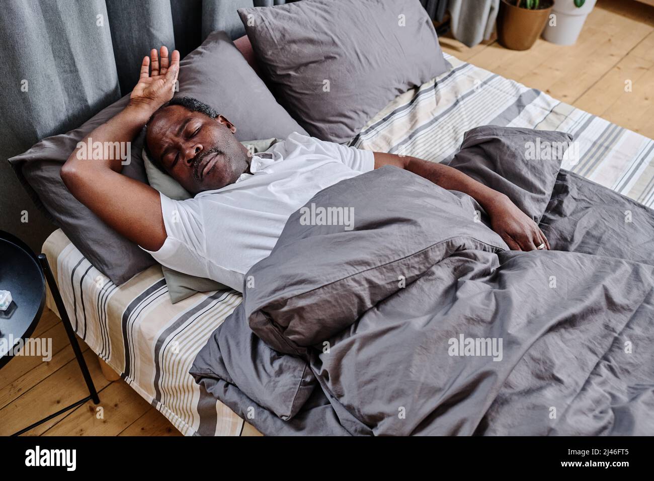 Man head under pillow in hi res stock photography and images Alamy