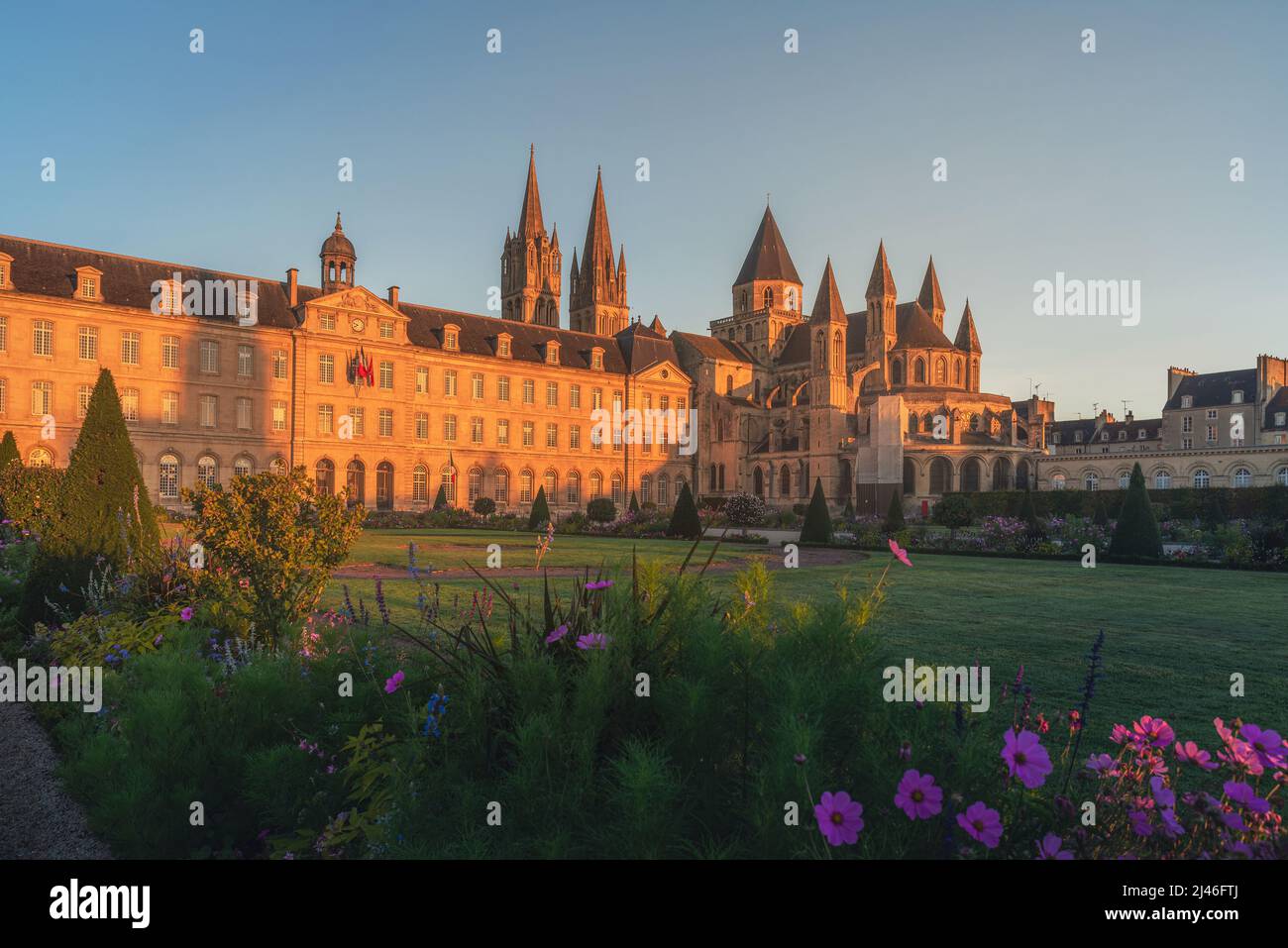 Caen, Normandy, France. Beautiful Abbey of Saint-Etienne or Abbaye aux Hommes and city hall at sunrise. former monastery. Popular tourist destination Stock Photo