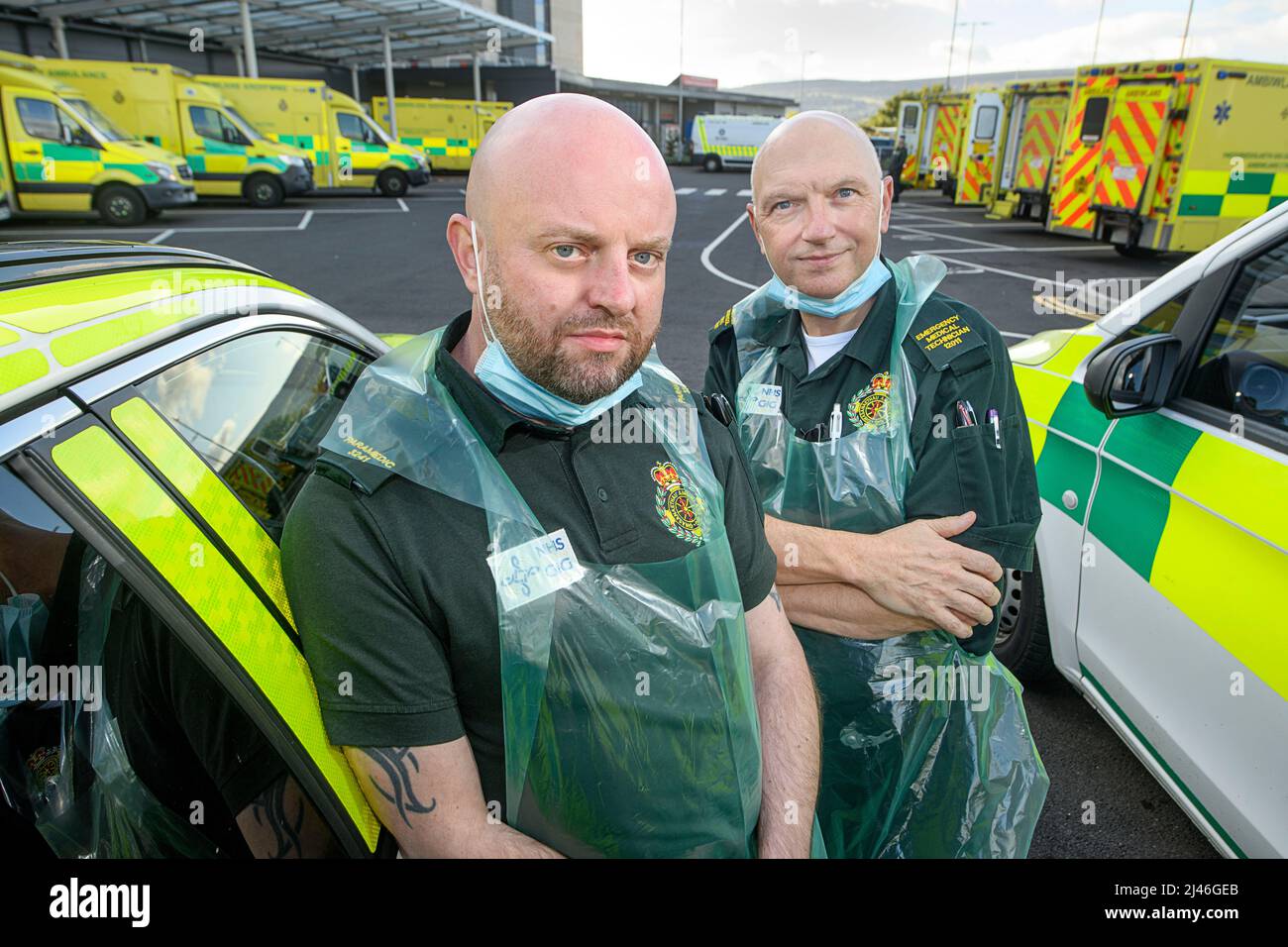 Portrait of a Paramedic and Emergency Medical Technician during the crisis of ambulances being forced to queue at hospitals with their patients inside Stock Photo