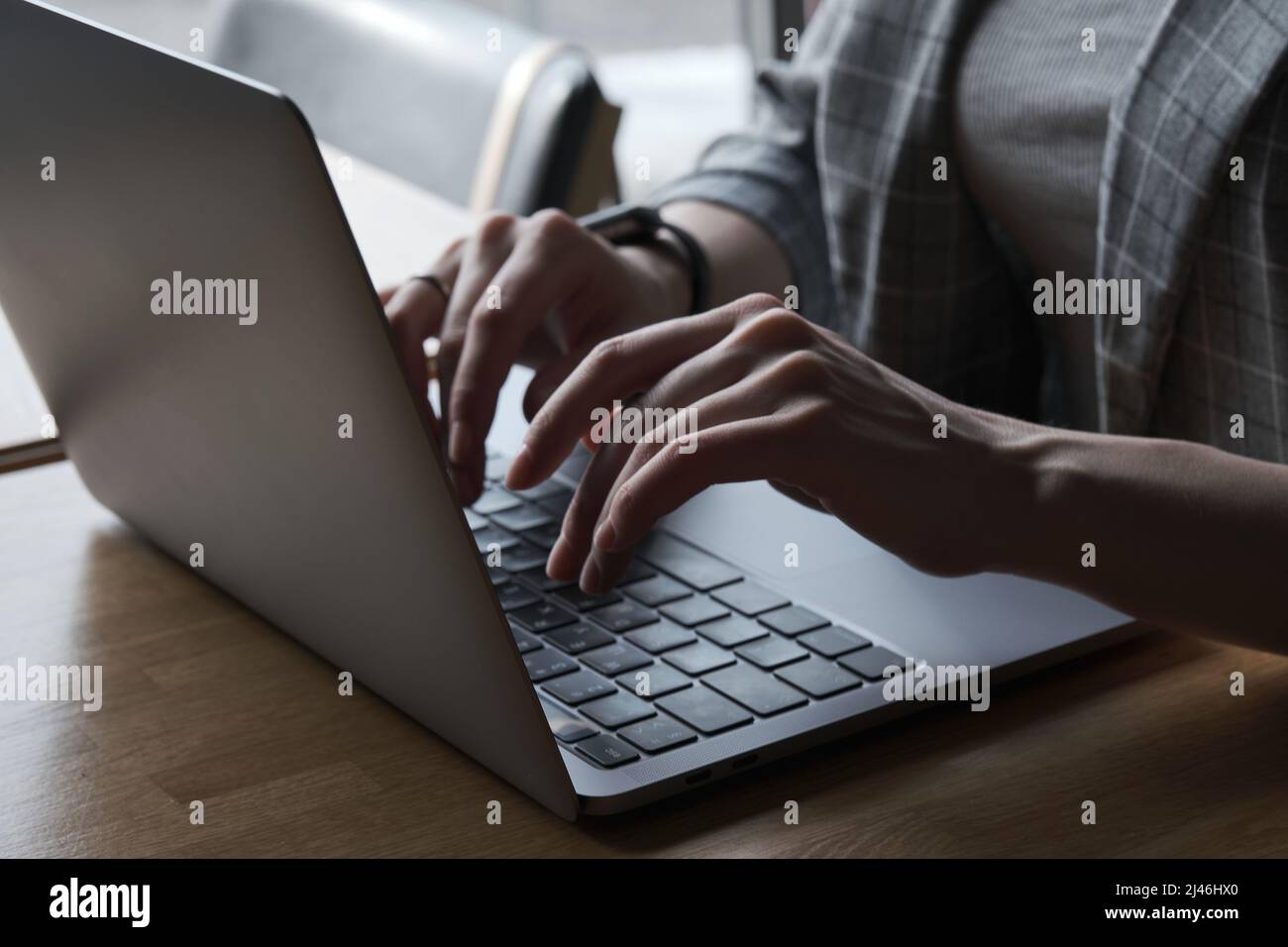 Hands typing on laptop keyboard Stock Photo