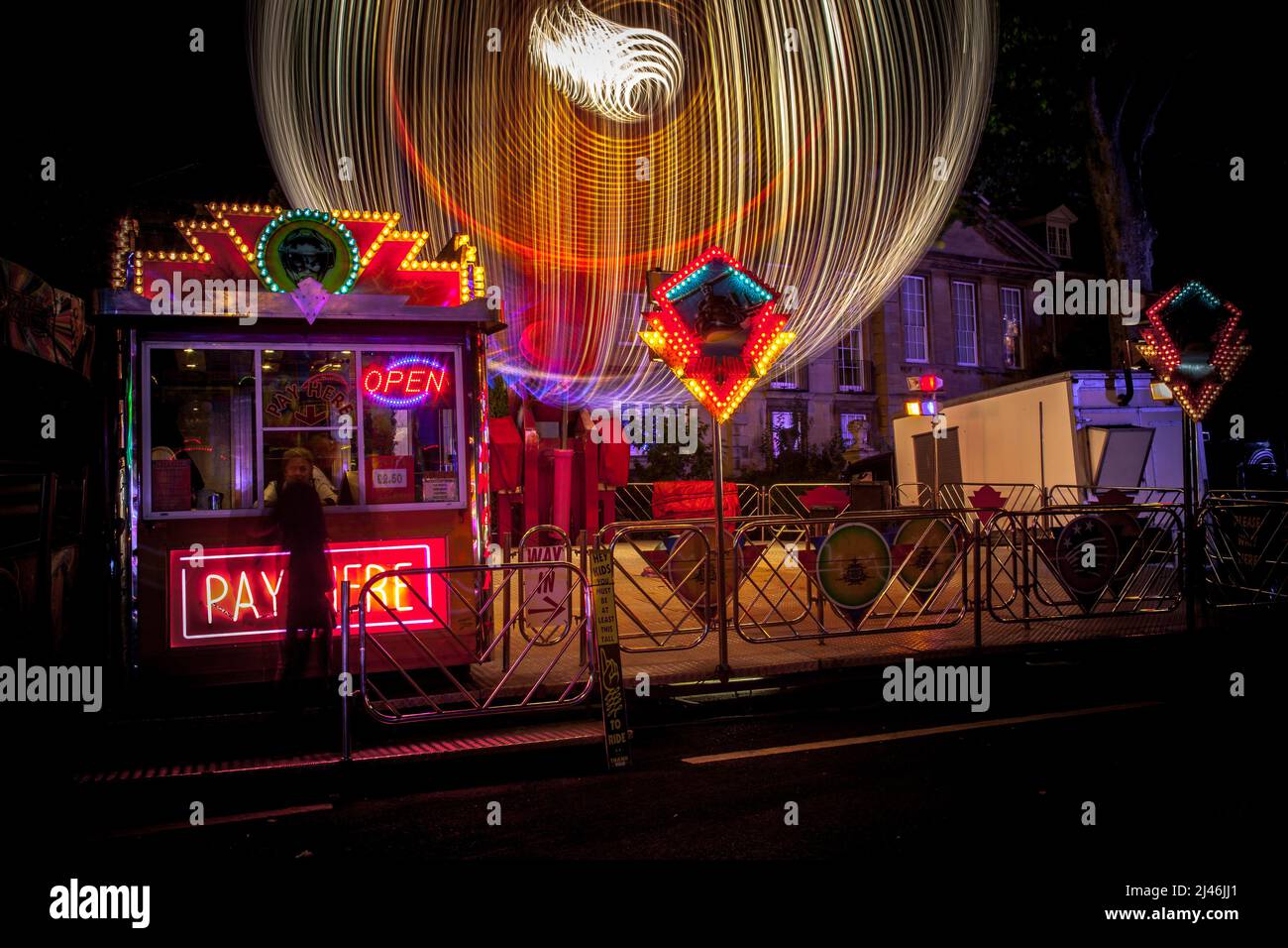 Fairground ride light trails from the annual travelling street fun fair in St Giles, Oxford. Stock Photo