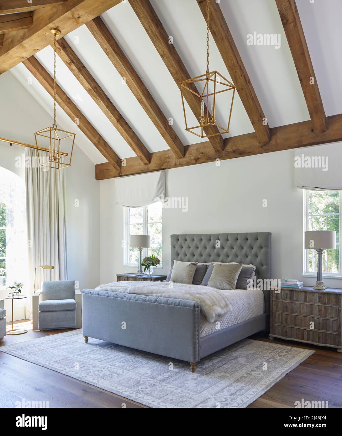 Bedroom with vaulted wood beam ceiling Stock Photo