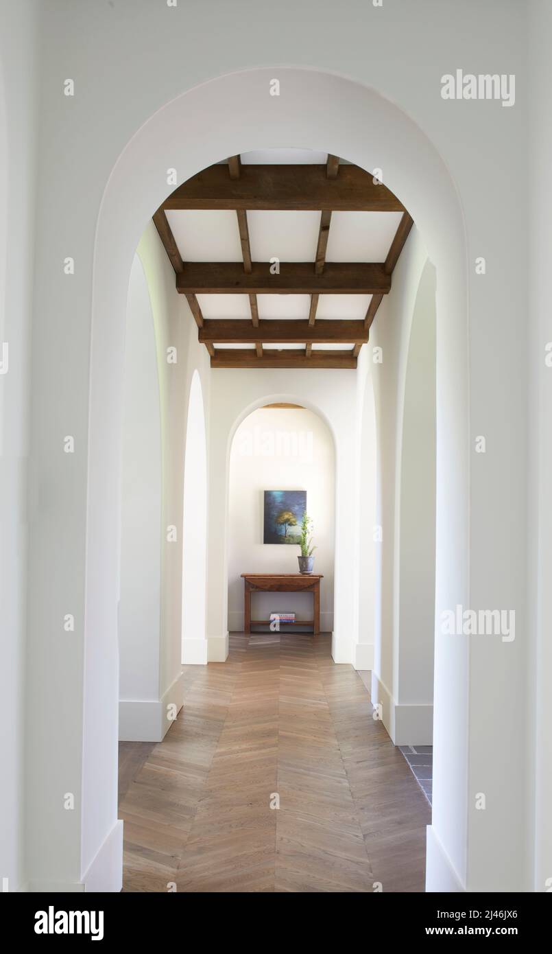 Arched hallway with wooden beam ceiling Stock Photo