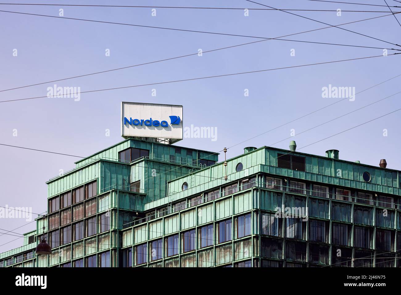 Nordea Bank sign on top of office building Vesterport (designed by Povl Baumann & Ole Falkentorp, 1932); Copenhagen, Denmark Stock Photo