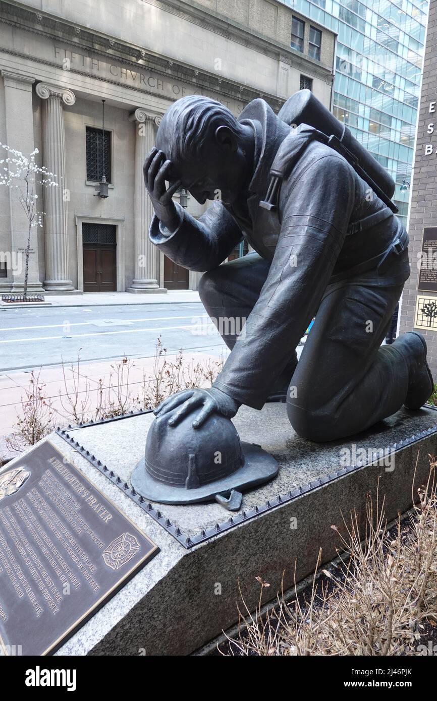 A Fire Fighter's Prayer statue, 43rd Street, Manhatten, New York,  USA Stock Photo