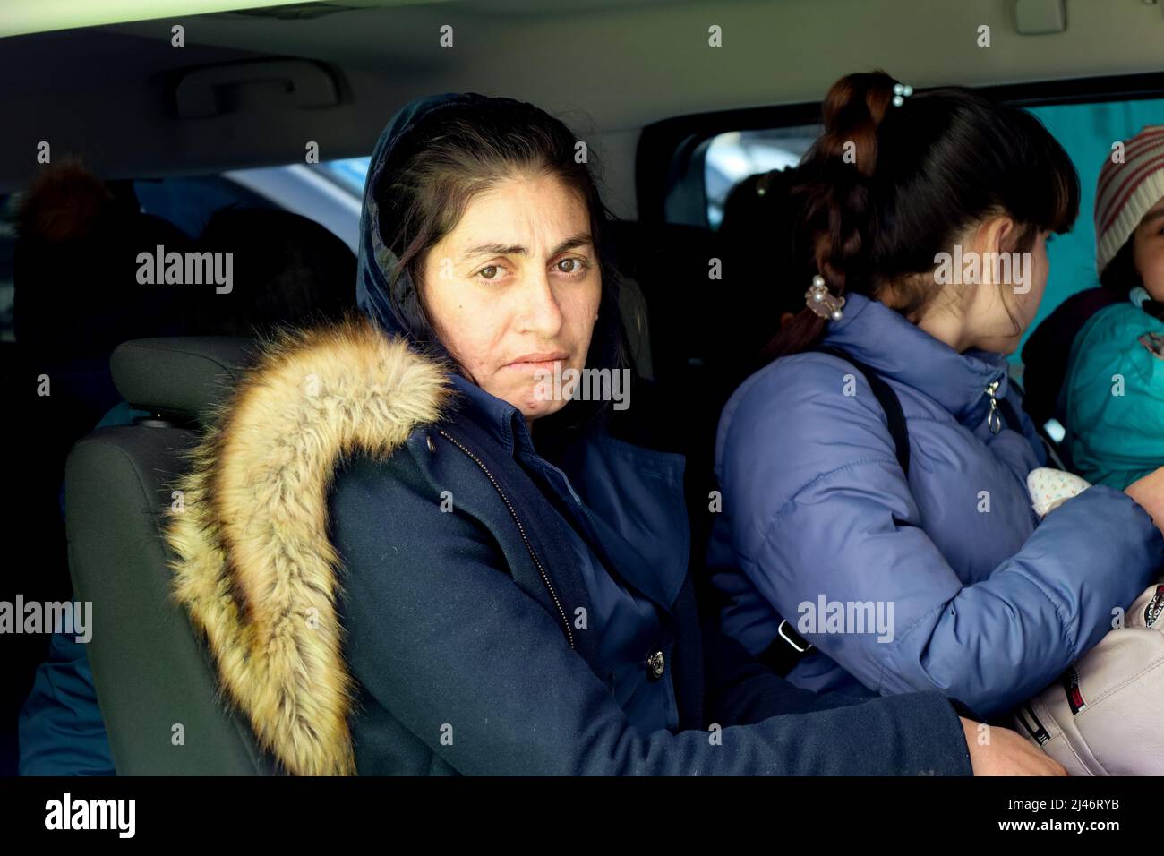 Przemysl, Poland. 11th Apr, 2022. Striking face of a Ukrainian Refugee and others who just escaped from the war in Ukraine in a van, bound for the Tesco humanitarian center, to arrange new homes in Poland and abroad. (Credit Image: © Amy Katz/ZUMA Press Wire) Stock Photo