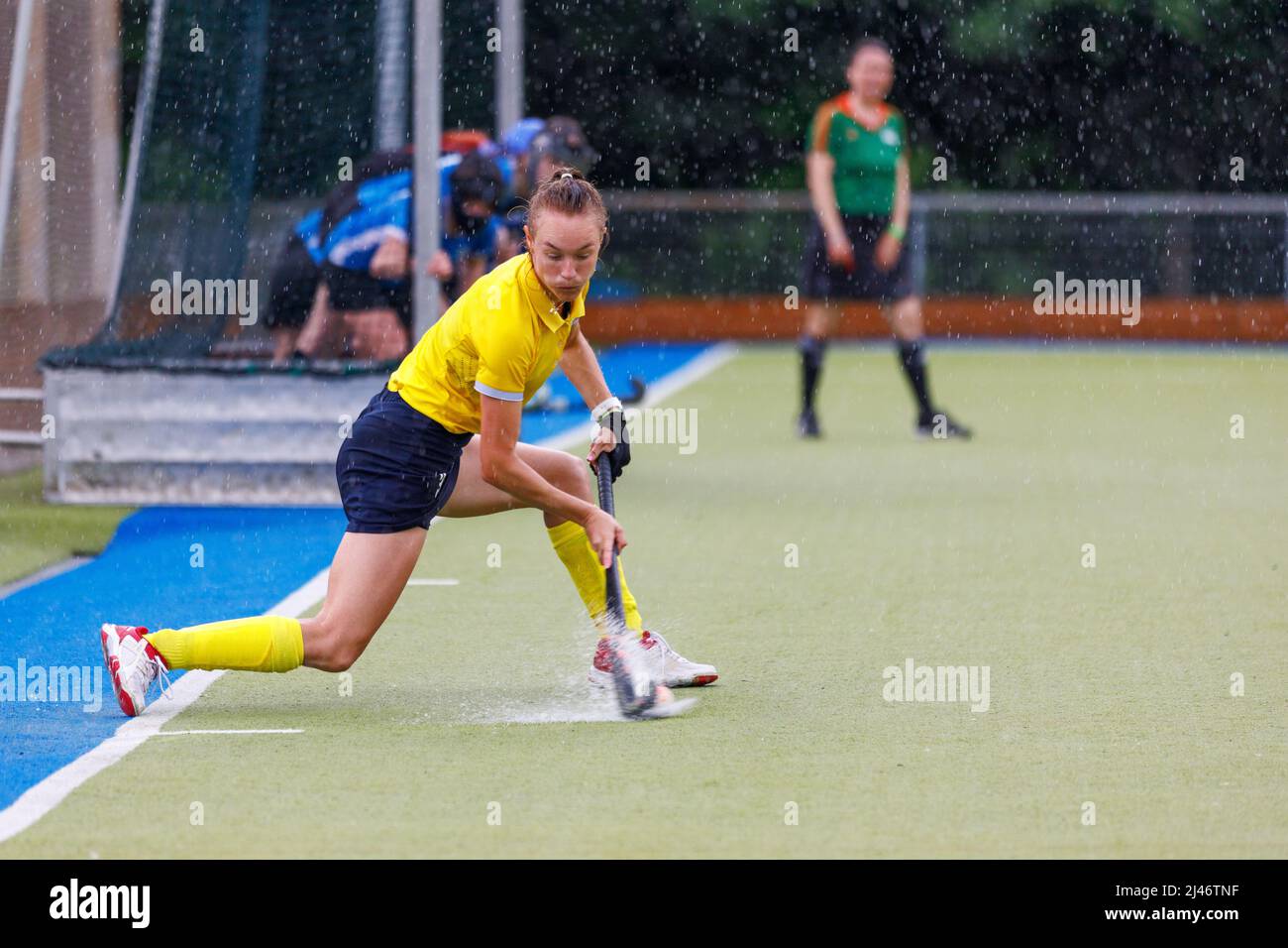 Female field hockey player performing penalty shot Stock Photo Alamy