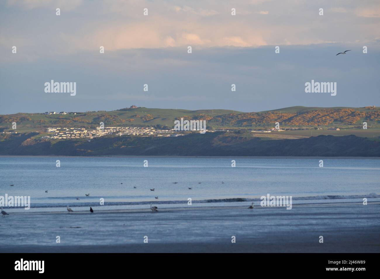 Filey Bay Beach On A Calm Peaceful Day - Blue Sky And Birds Flying about - Tourist Destination + Holiday Resort In North Yorkshire - UK Stock Photo