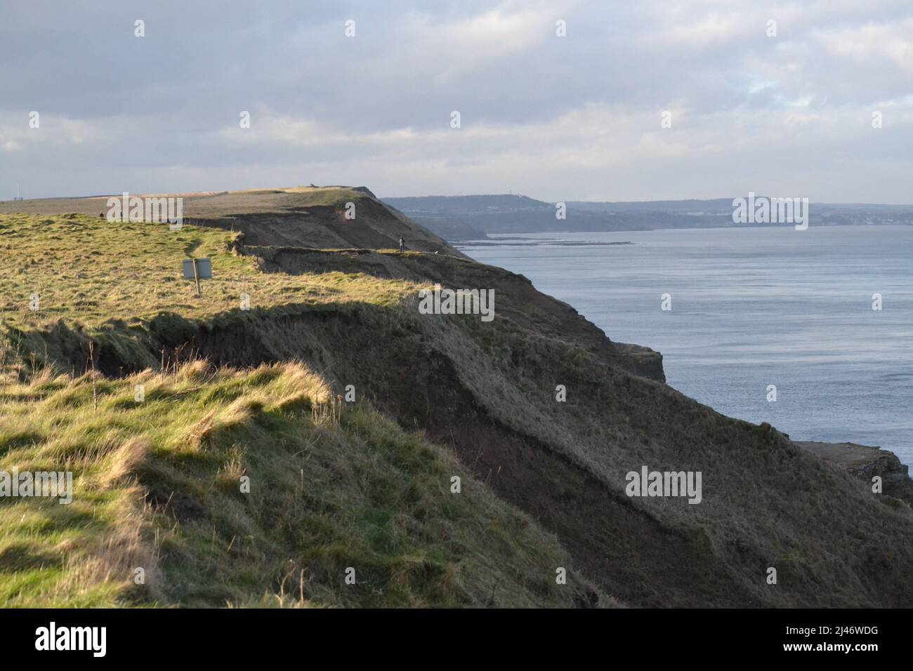 Cliffs & North Sea Looking Towards Scarborough From Filey - Cleveland Way Footpath - Blue Sky + Sea - Green Grass On The Cliff Tops - North Yorkshire Stock Photo