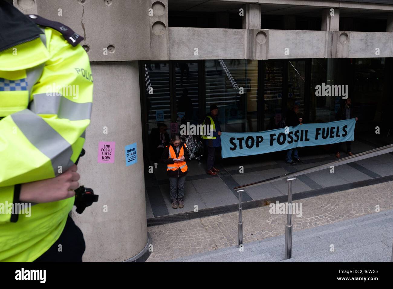 London, UK. 12th Apr, 2022. 40 Extinction Rebellion (XR) activists blocked all entrances to Lloyds of London, shutting the building for the day. Lloyd's of London insures 40% of the world's coal, oil and gas projects. XR is demanding they stop insuring fossil fuels. Today was part of a week long wave of protests and civil disobedience actions to demand an immediate stop to all new fossil fuel infrastructure by the British government amid the climate crisis and ecological emergency. Stock Photo