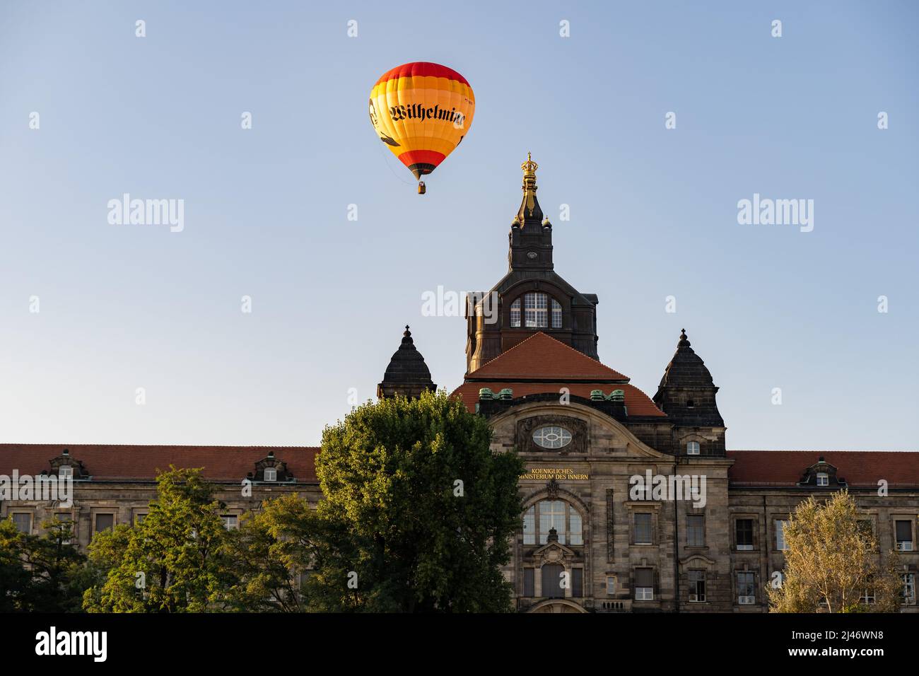 Hot air balloon in the sky over the building of the ministry of the  interior. Famous building of the government in Saxony. Old architecture on  a day Stock Photo - Alamy