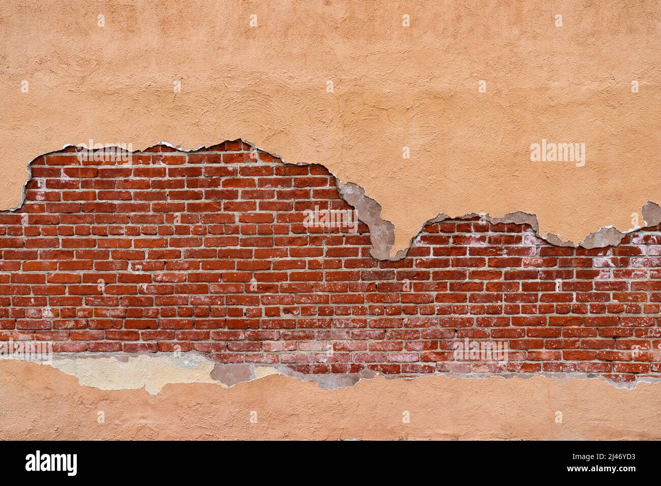 Brick wall background framed with stucco Stock Photo