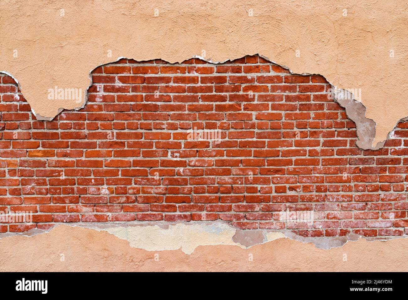 Brick wall background framed with stucco Stock Photo