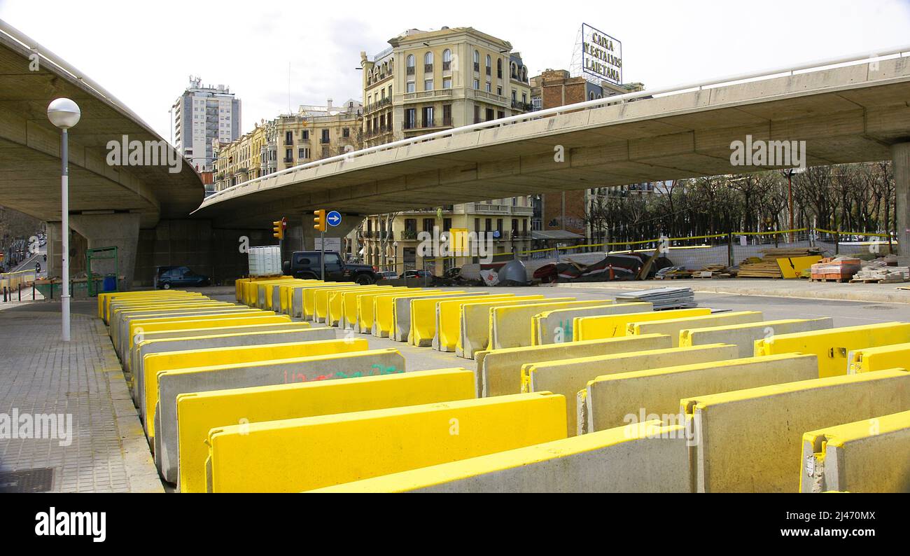 Provisional concrete or plastic barrier in the deconstruction works of the ring road in the Plaza de Les Glories in Barcelona, Catalonia, Spain, Europ Stock Photo