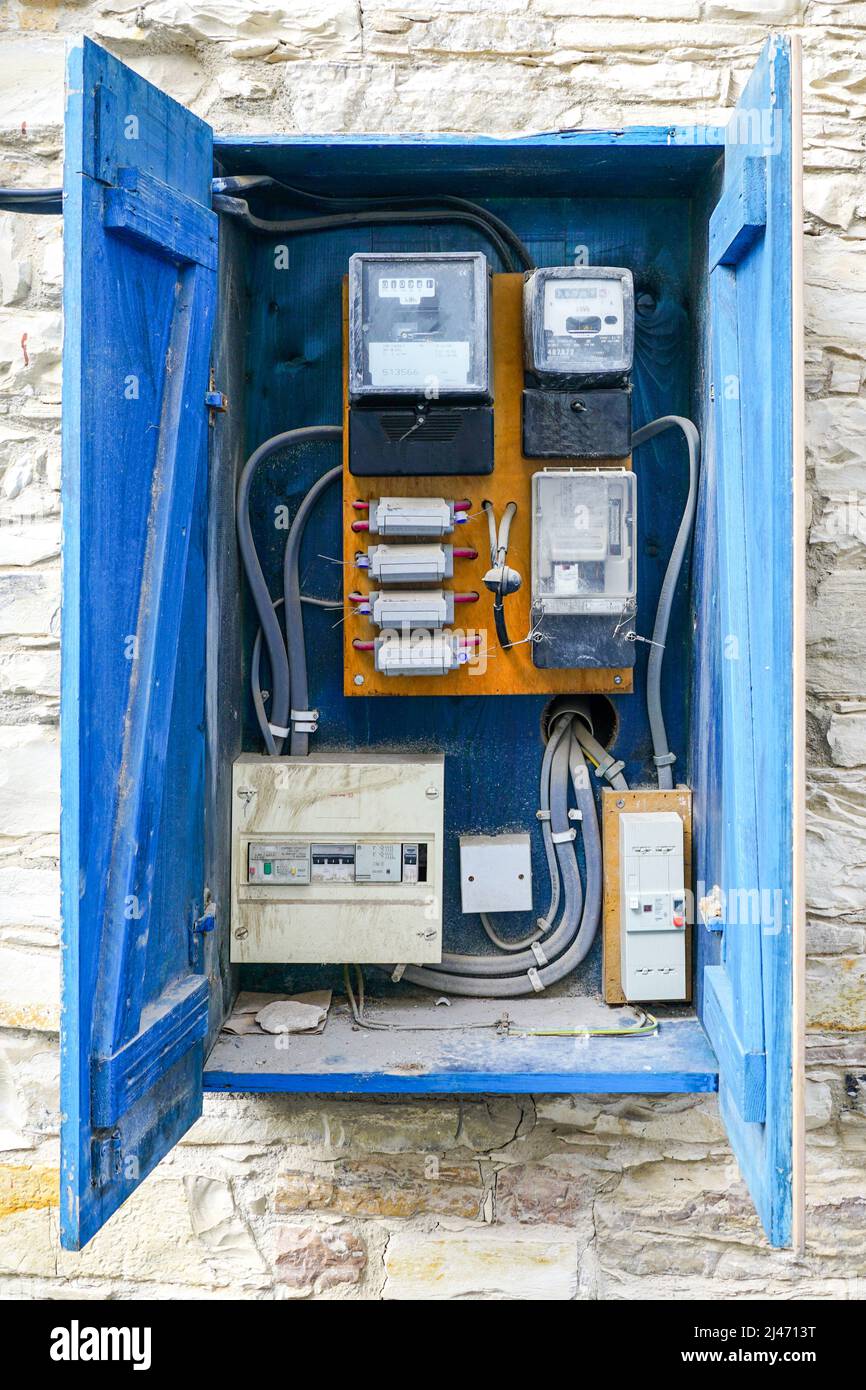 open outdoor vintage blue wooden electrical control with