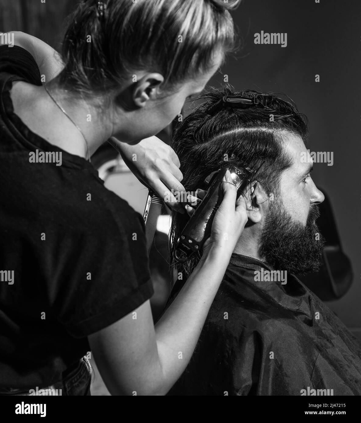 master Barber does the hairstyle and styling with electric shaver to