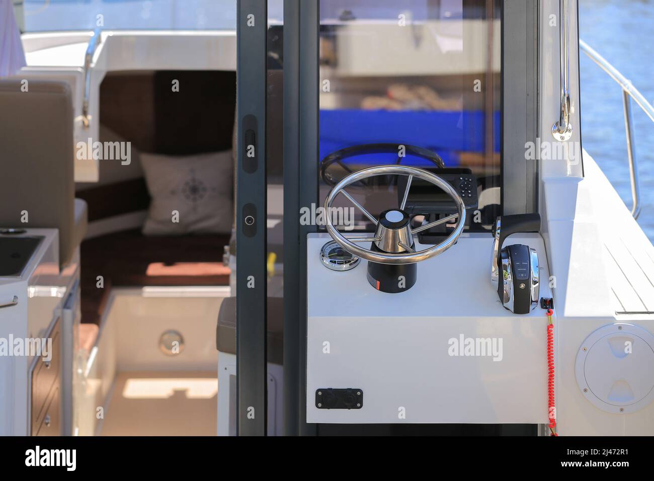 Cockpit modern motor boat with steering wheel and throttle control