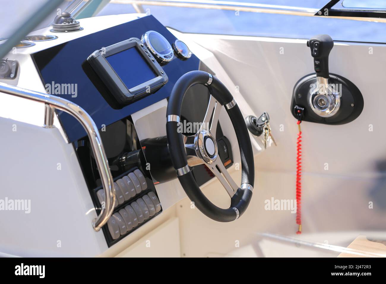 Cockpit modern motor boat with steering wheel and throttle control