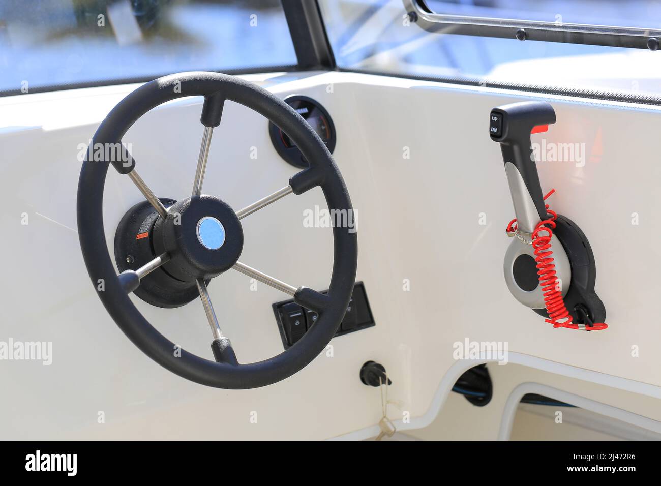 Cockpit modern motor boat with steering wheel and throttle control
