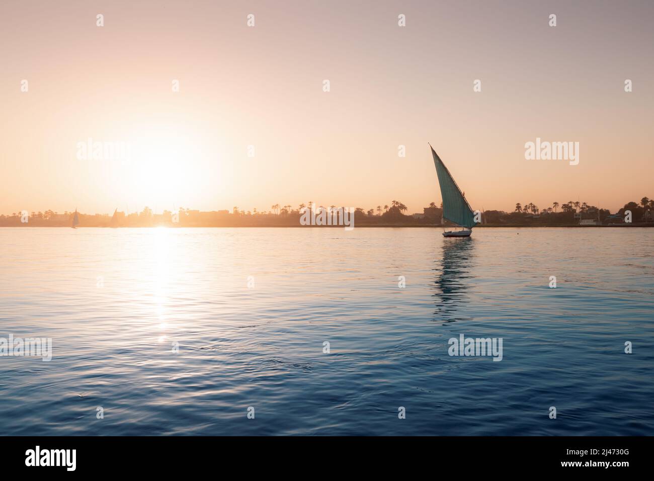 Felucca traditional sailing boat and cruise at the Nile river in Luxor ...
