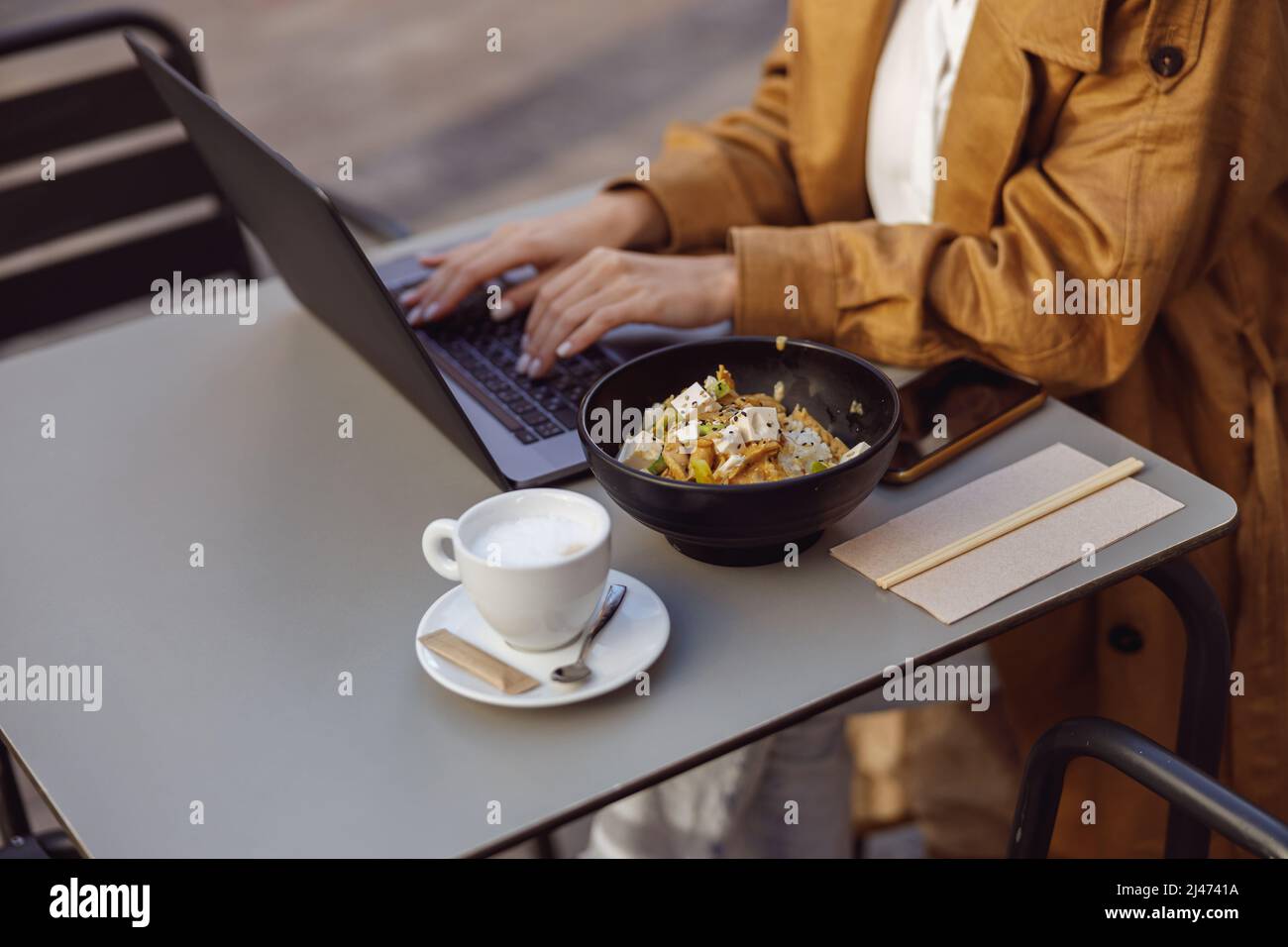 Close-up of woman hand typing something on laptop Stock Photo