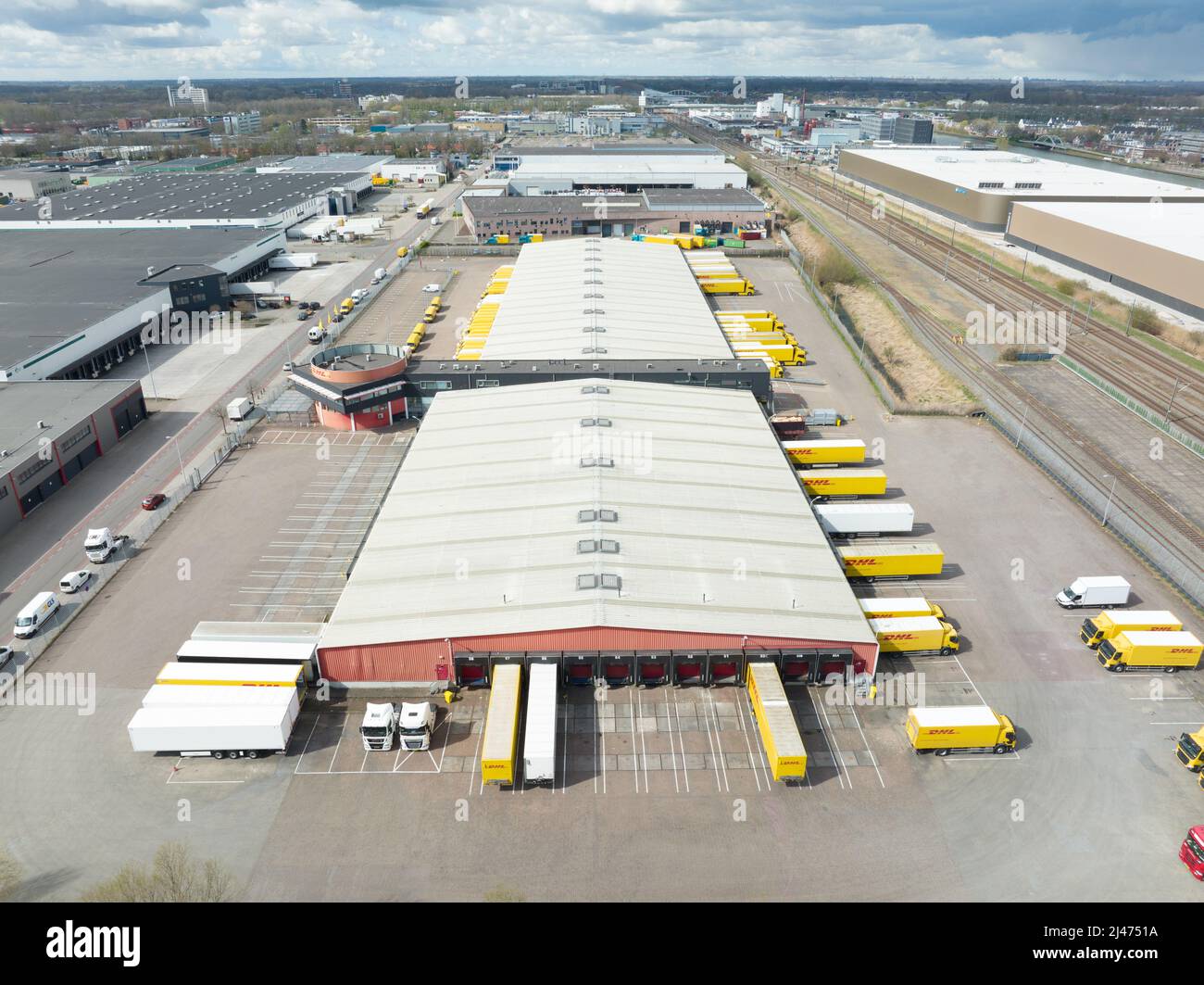Utrecht, 3th of april 2022, The Netherlands. DHL delivery and distribution  packaging warehouse with delivery trucks and vans company building. Aerial  Stock Photo - Alamy