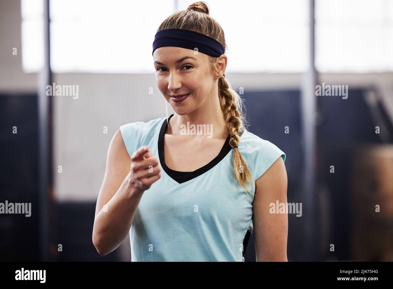Im looking forward to seeing you at the gym. Shot of a fit young woman at the gym for a workout. Stock Photo