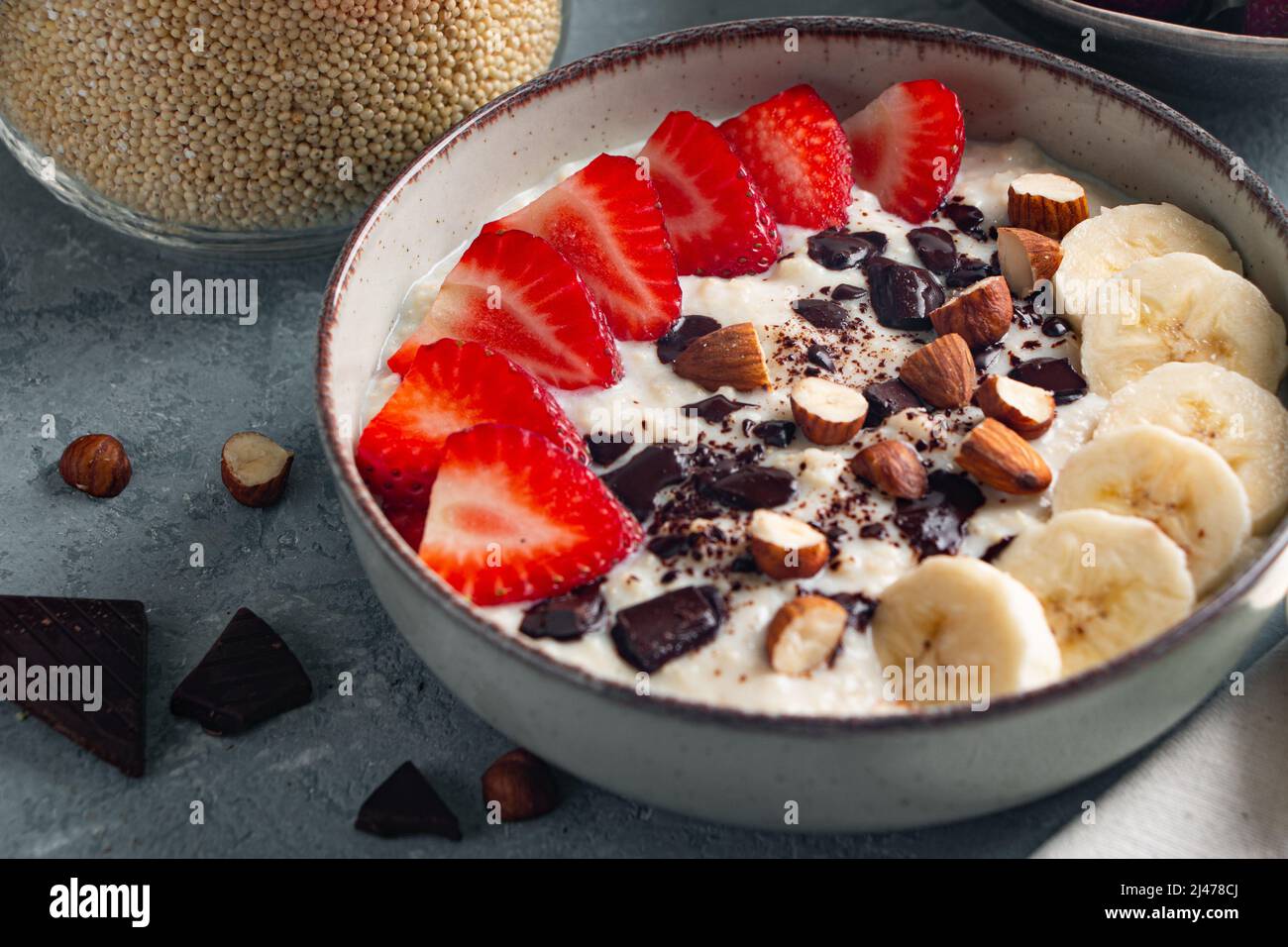 Millet porridge with strawberry, banana, dark chocolate pieces