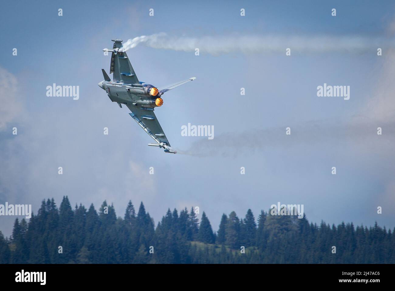 Bundesheer Austrian Air Force Eurofighter military jet plane with full afterburner in the sky performing a flying display Stock Photo