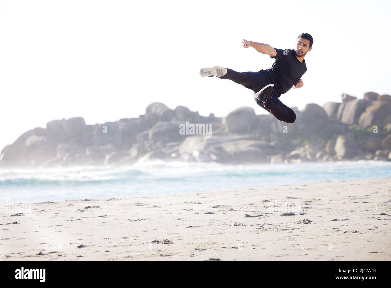Flying through his fitness routine. Full length shot of a handsome ...
