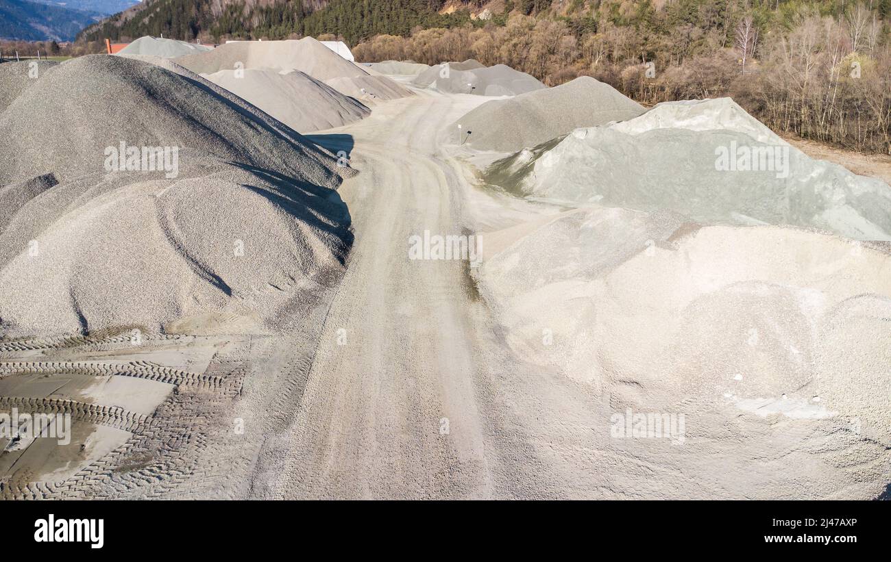 Gravel and stones as building material on a storage area in a stone pit in Austria Stock Photo