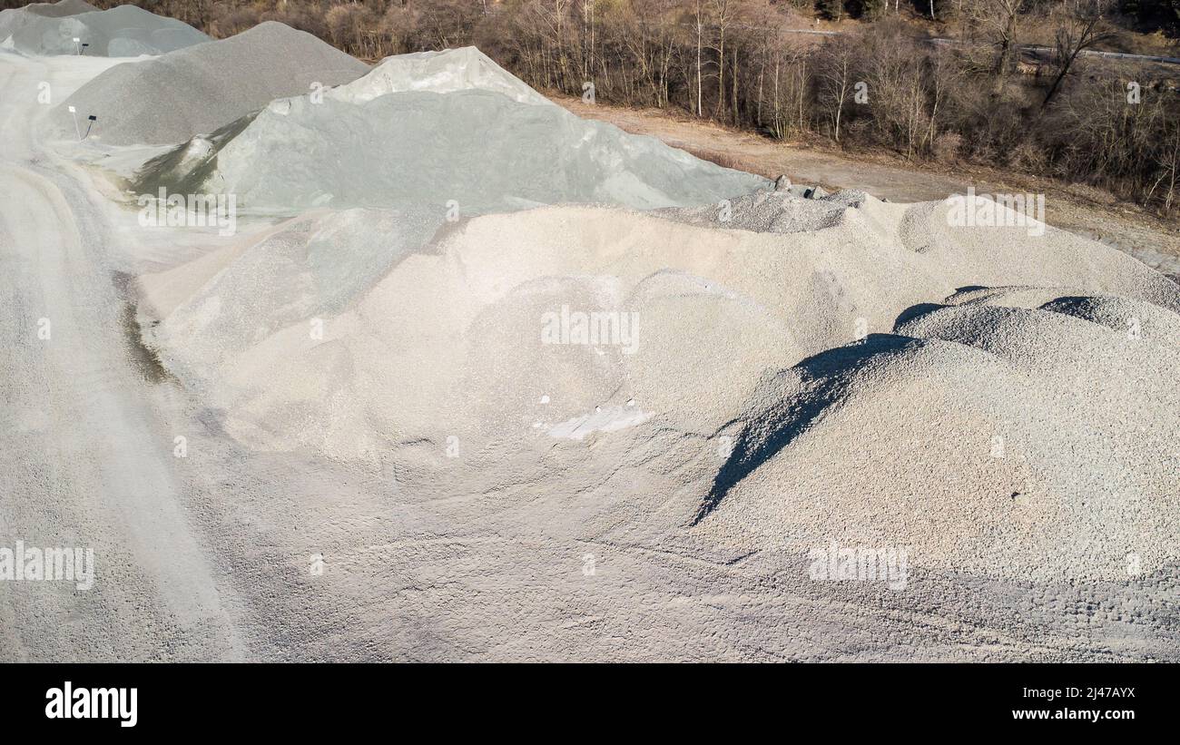Gravel and stones as building material on a storage area in a stone pit