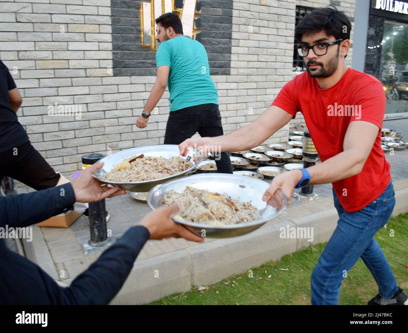 Karachi, Pakistan. 12th Apr, 2022. People prepare food for iftar during ...