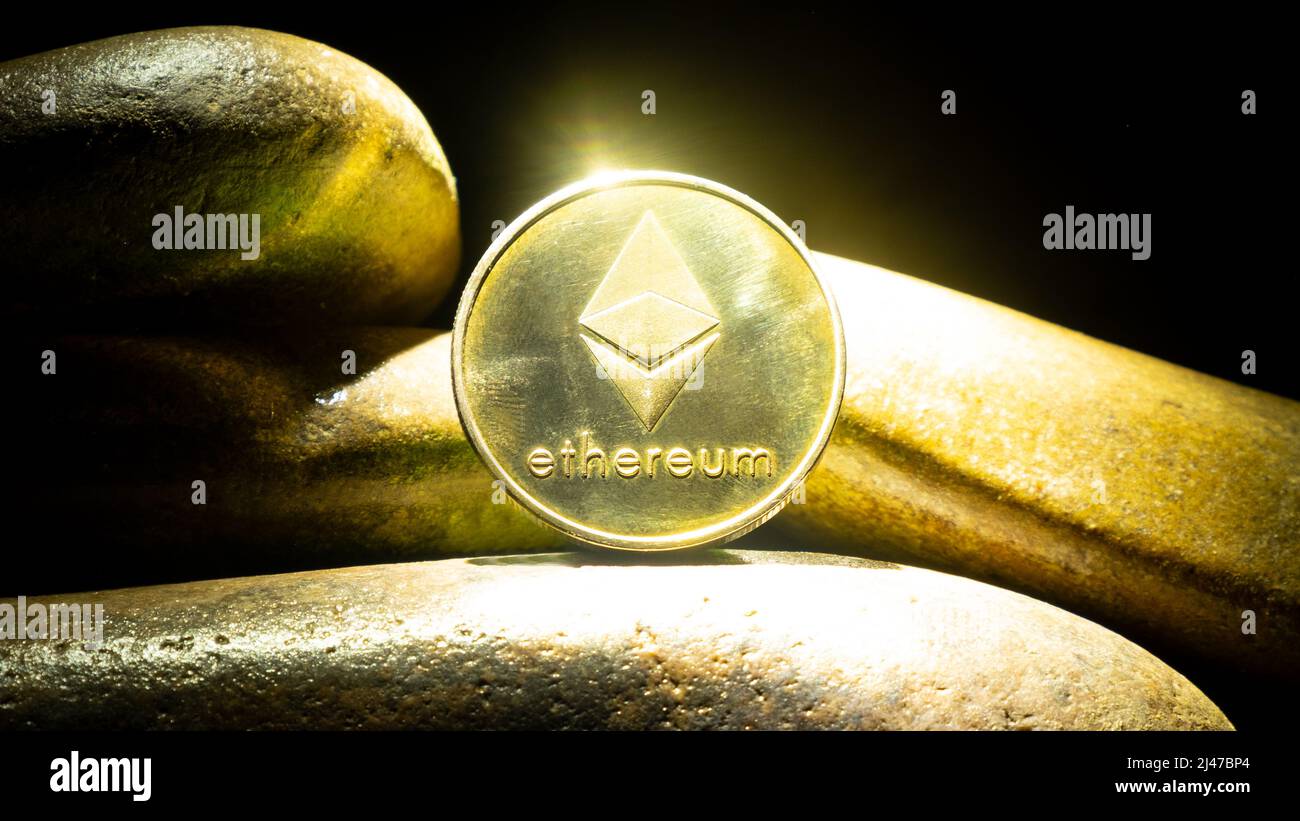 cryptocurrency btc, bitcoin gold coin on stones. Stock Photo