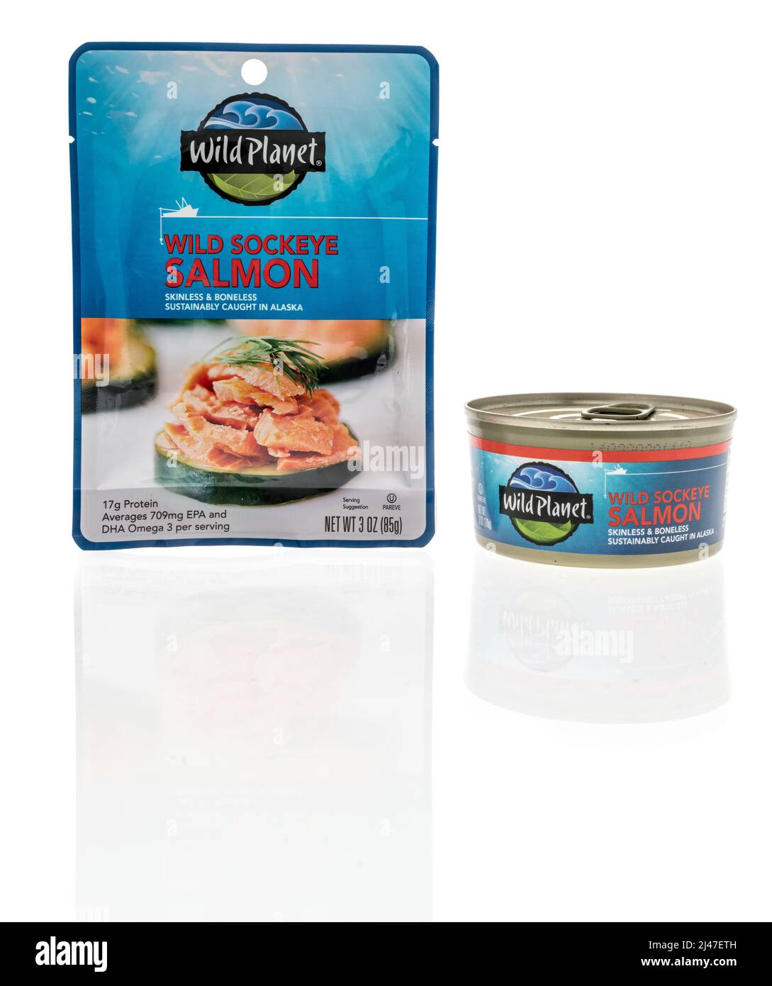 Winneconne, WI -10 April 2022: A can and package of Wild planet wild sockeye salmon on an isolated background Stock Photo