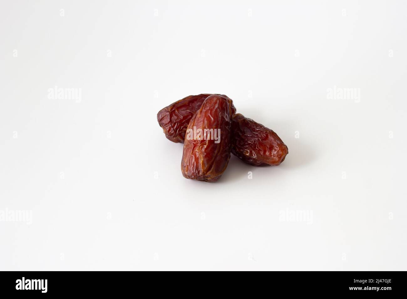 abstract Date fruit isolated on white background or texture Stock Photo
