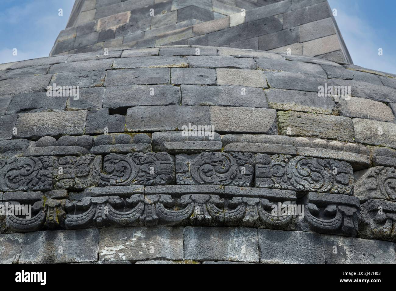 Borobudur, Java, Indonesia.  Stone Relief Carving around the Base of the Highest Stupa of the Temple. Stock Photo